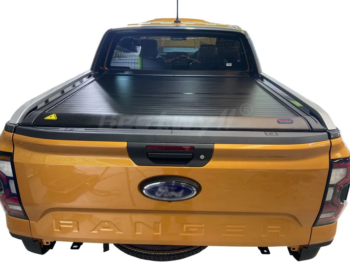 Closed electric tonneau cover protecting truck cargo