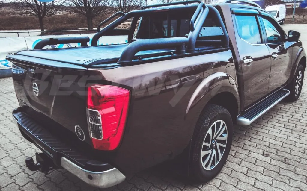 Electric tonneau cover protecting truck cargo