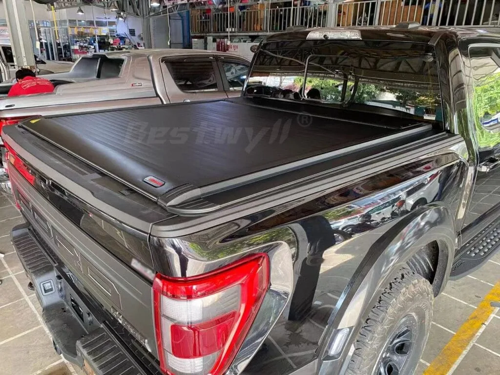 Key controlled electric roller cover for Ford