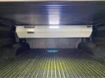 Remote controlled retractable truck bed cover with light