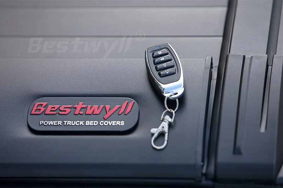 Key for electric truck bed cover