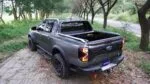 Fully retracted Ford Ranger truck bed cover providing full cargo access