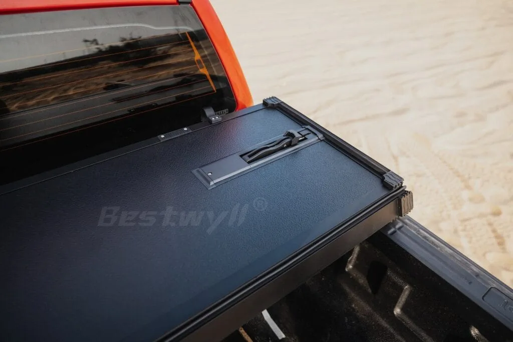 Pickup truck with tri-fold cover