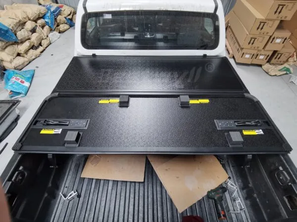 Hard tri fold truck bed cover
