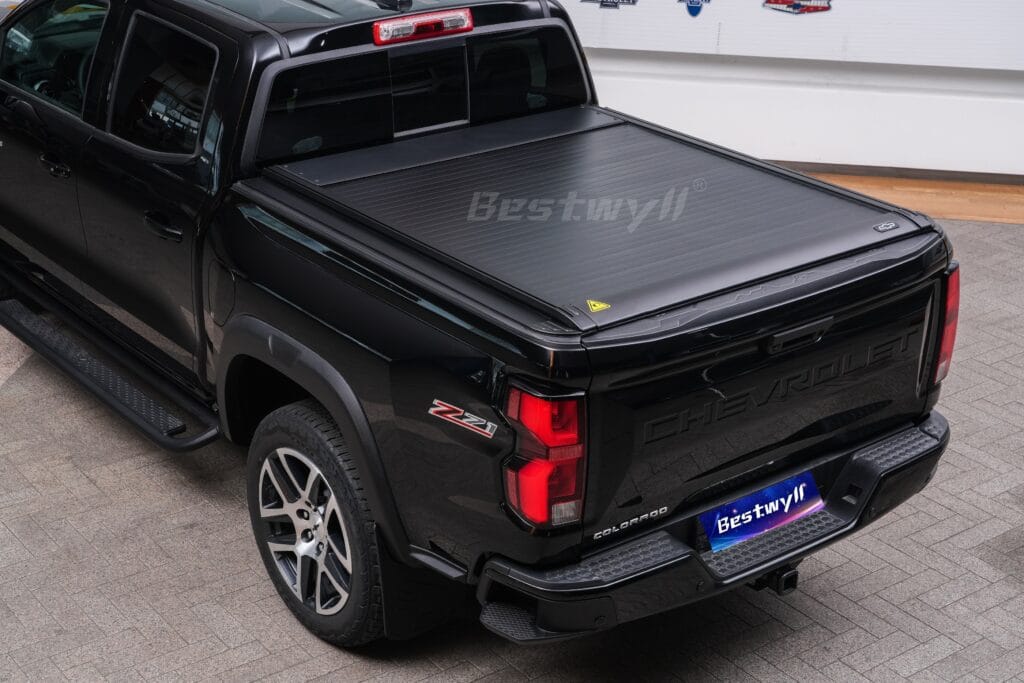 Key controlled tonneau cover for GMC